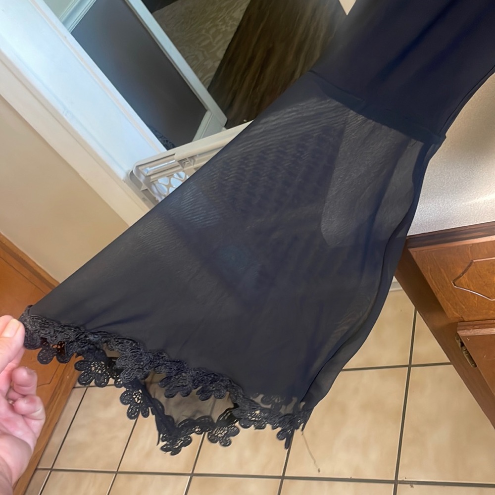 Beautiful black dress made of Polyester and spandex. Worn once.